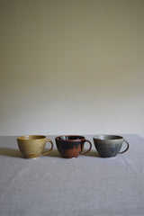 Pottery West Curved Mug - Ochre